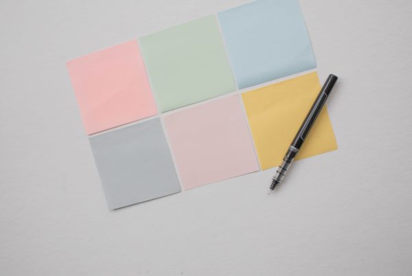 Blank colourful postit notes with pen