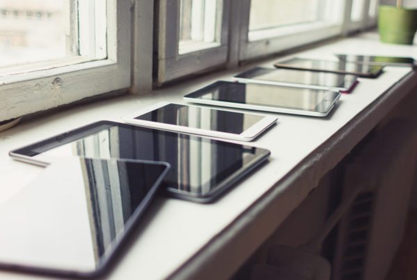 Tablets sitting on a window sill