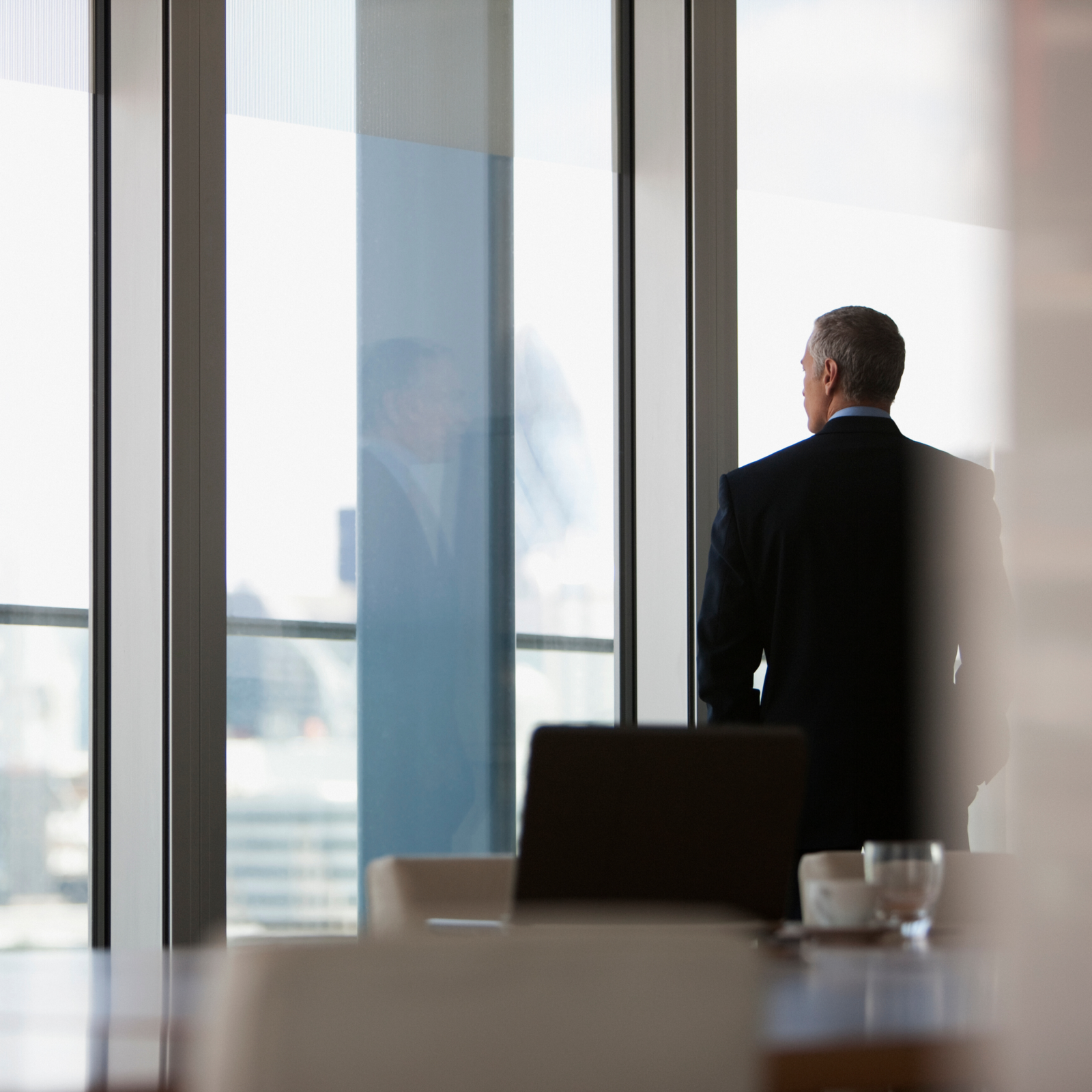 Businessman looking out of window